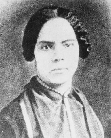 Mary Ann Shadd Cary with pinned hairstyle in a black and white photo.