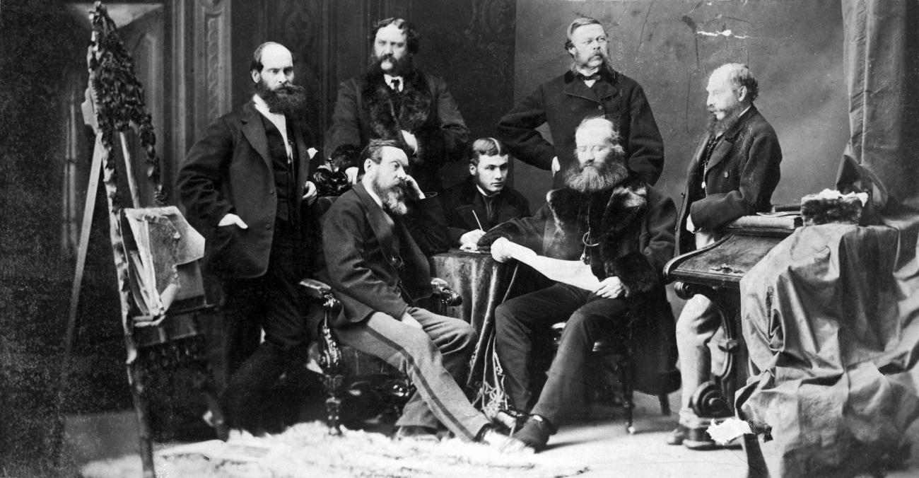 Black and white photo of Sandford Fleming and six other men.