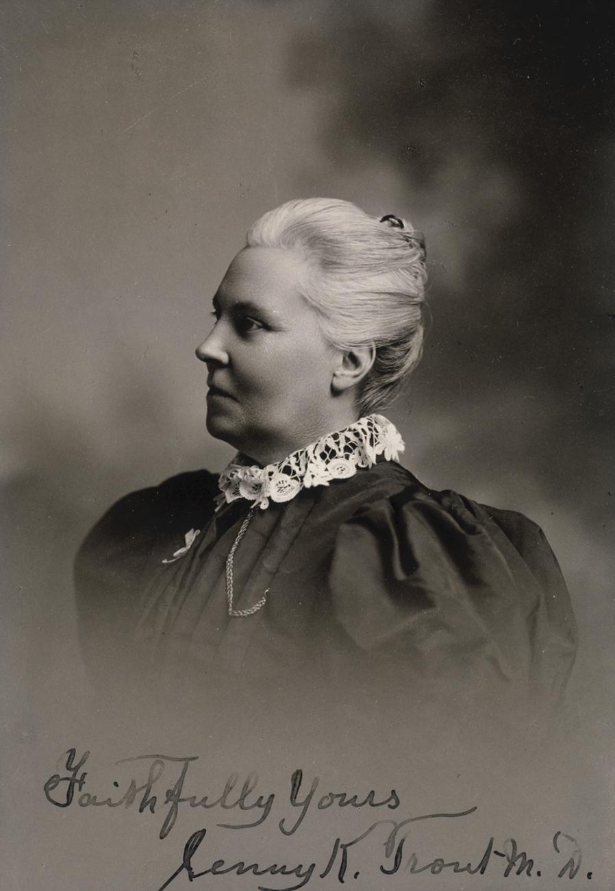 black and white head and shoulders portrait of Jennie Trout in dark dress with high lace collar.